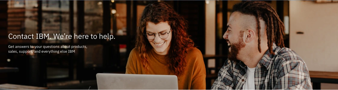 XD prototype hero showing two people working together at a laptop beside the words Contact IBM, We're here to help